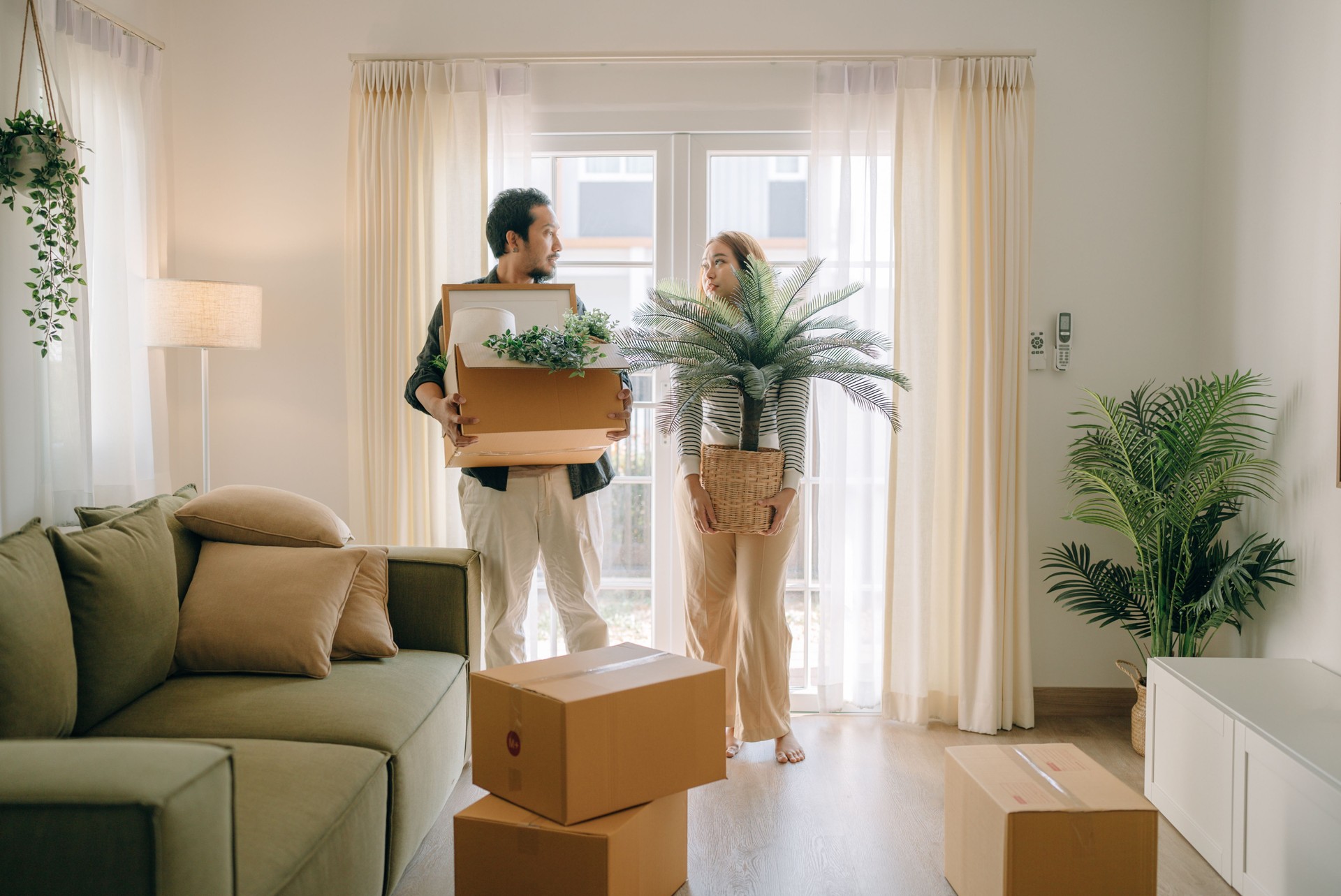 Happy couple moving new house.